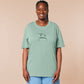 An embroidered green t-shirt design of a funny cartoon frog with the text a concern.