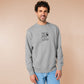 An embroidered light grey sweater design of the Australian Jack Karlson being arrested while he shouts Eating A Meal? A Succulent Chinese Meal?!