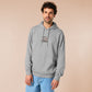 An Embroidered light grey hoodie design of a cute chibsuper dog wearing a red cape panicked at a dice with the text rolling one is my superpower