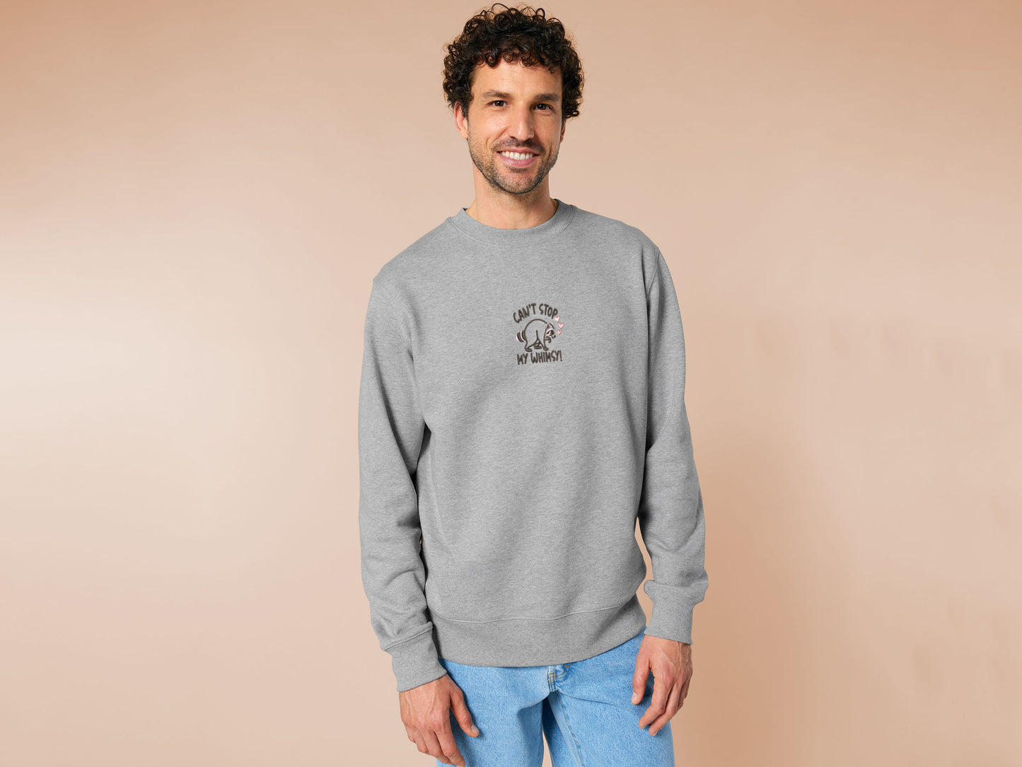 An Embroidered light grey sweater design of a cute Jimothy the viral disabled raccoon and the quote can't stop my whimsy!
