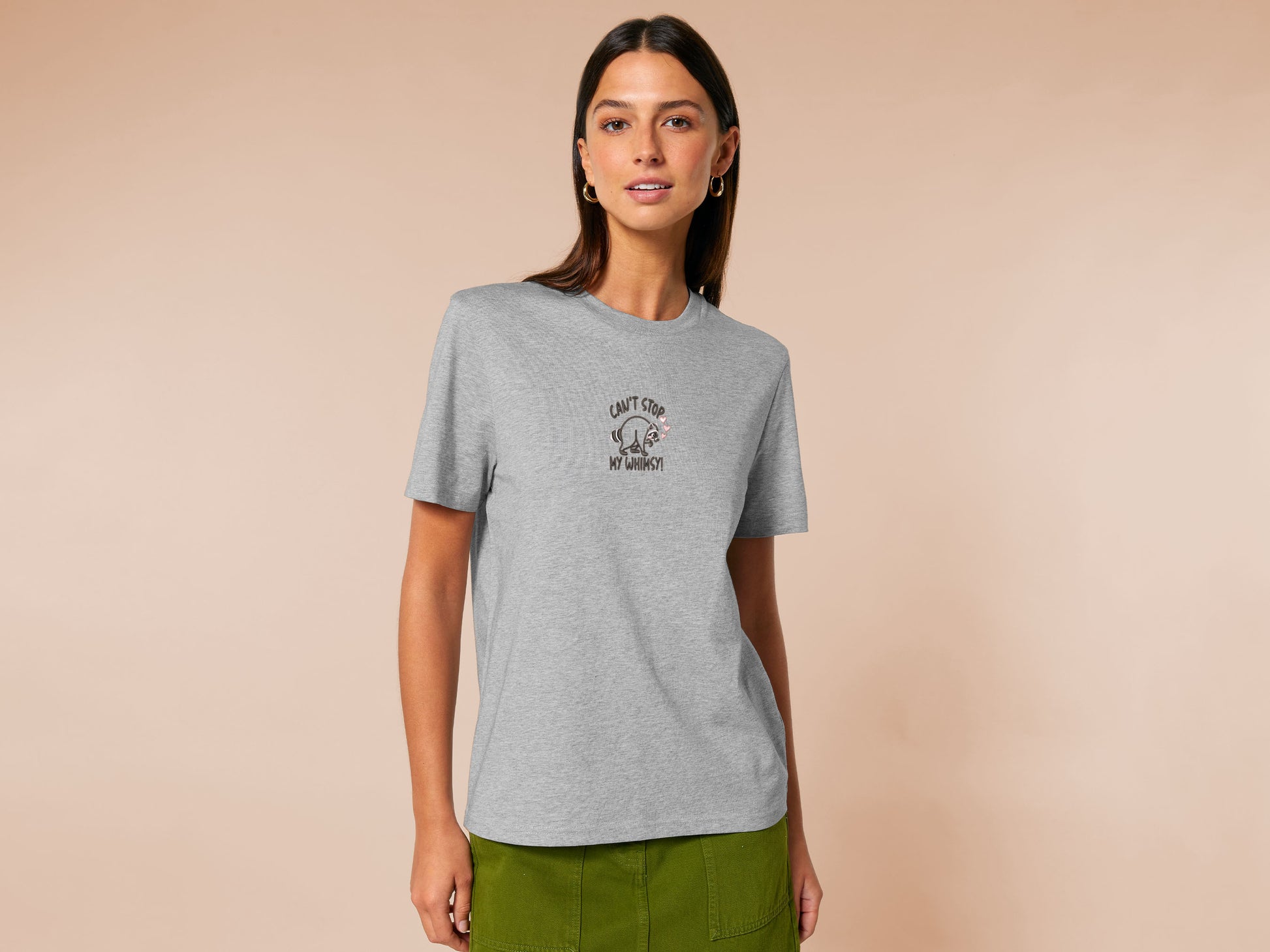 An Embroidered light grey t-shirt design of a cute Jimothy the viral disabled raccoon and the quote can't stop my whimsy!
