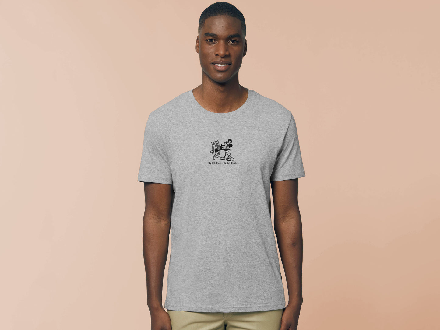 Man in short sleeved grey t-shirt with an Embroidered Black Steamboat Willie Design From Disney's original Mickey Mouse Animation with the text *My OC, Please Don't Steal.