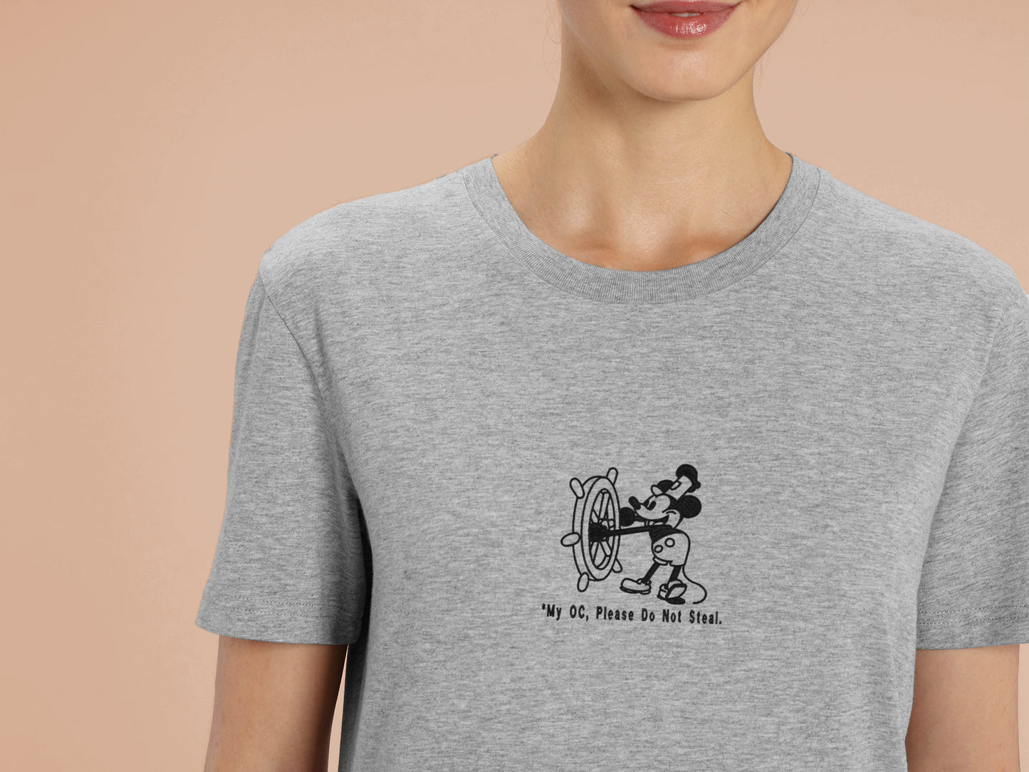 Woman in short sleeved grey t-shirt with an Embroidered Black Steamboat Willie Design From Disney's original Mickey Mouse Animation with the text *My OC, Please Don't Steal.
