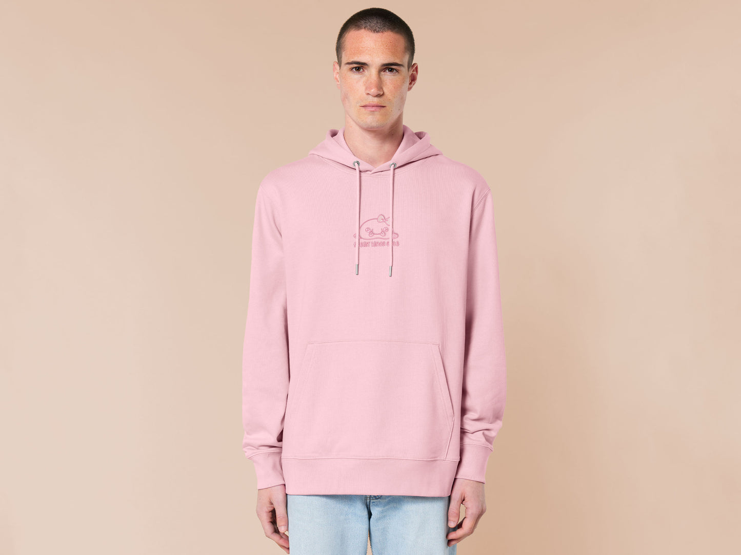 Pink embroidered hoodie with a cute chibi blobfish wearing a bow surrounded by the quote feelin kinda cute