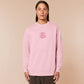 Pink embroidered sweater with a cute chibi guinea pig hamster wearing heart-shaped sunglasses and driving a little pink car surrounded by the quote the horrors persist but so do I.