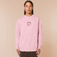 Pink embroidered sweater with a cute chibi panicking pig surrounded by the quote please don't perceive me