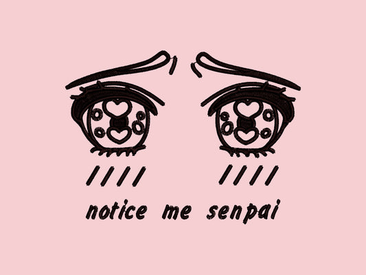 A pink crew neck short sleeve t-shirt, with an embroidered brown thread design of cute anime style heart eyes with blushing cheeks and worried eyebrows, with the text notice me senpai written underneath.