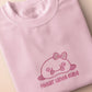 Pink embroidered t-shirt with a cute chibi BLOBFISH wearing a bow surrounded by the quote feelin kinda cute