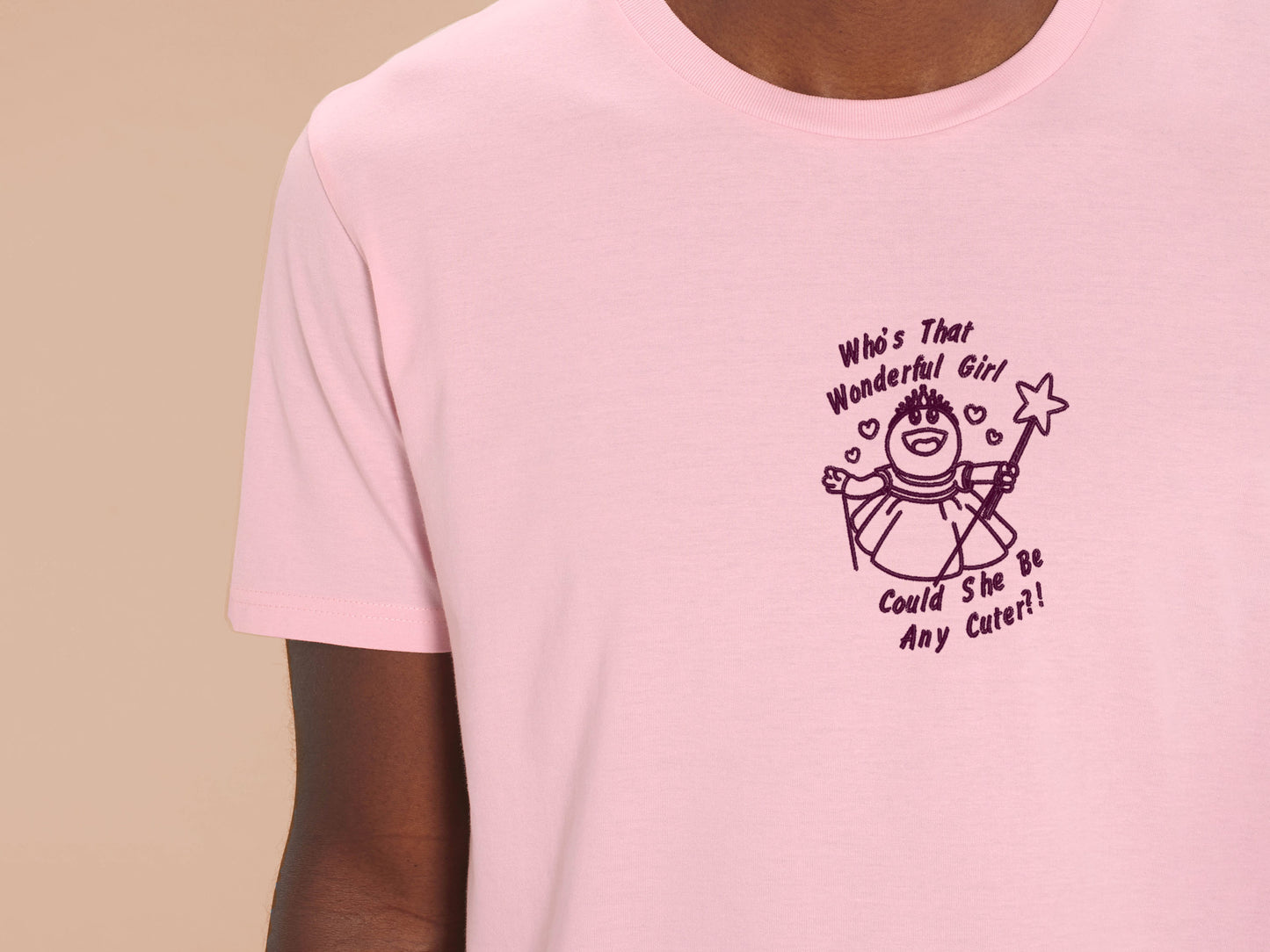 An embroidered t-shirt design of Mona from the puppet show Nanalan in a princess dress with the text Who's That Wonderful Girl, Could She Be Any Cuter?!