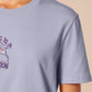 Purple embroidered tshirt with a cute design of a chibi owlbear crying holding a d20 dice that has rolled a one with the quote Crying Is A Free Action