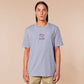 Purple embroidered tshirt with a cute design of a chibi owlbear crying holding a d20 dice that has rolled a one with the quote Crying Is A Free Action