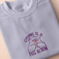 Purple embroidered cute design of a chibi owlbear crying holding a d20 dice that has rolled a one with the quote Crying Is A Free Action