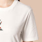 An embroidered white t-shirt design of a blood drenched meeple holding a knife with text When I Play Board Games I Have No Friends