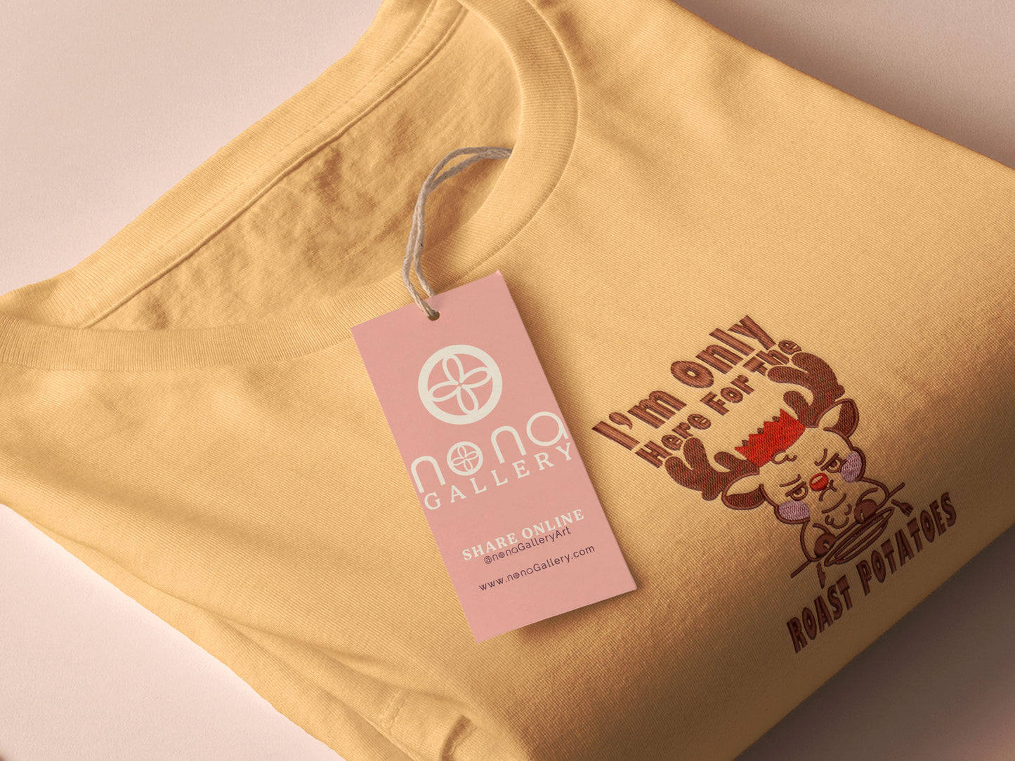 A yellow crew neck long sleeve sweater, with an embroidered design of a cute sulking Rudolph reindeer and the quote I'm only here for the roast potatoes