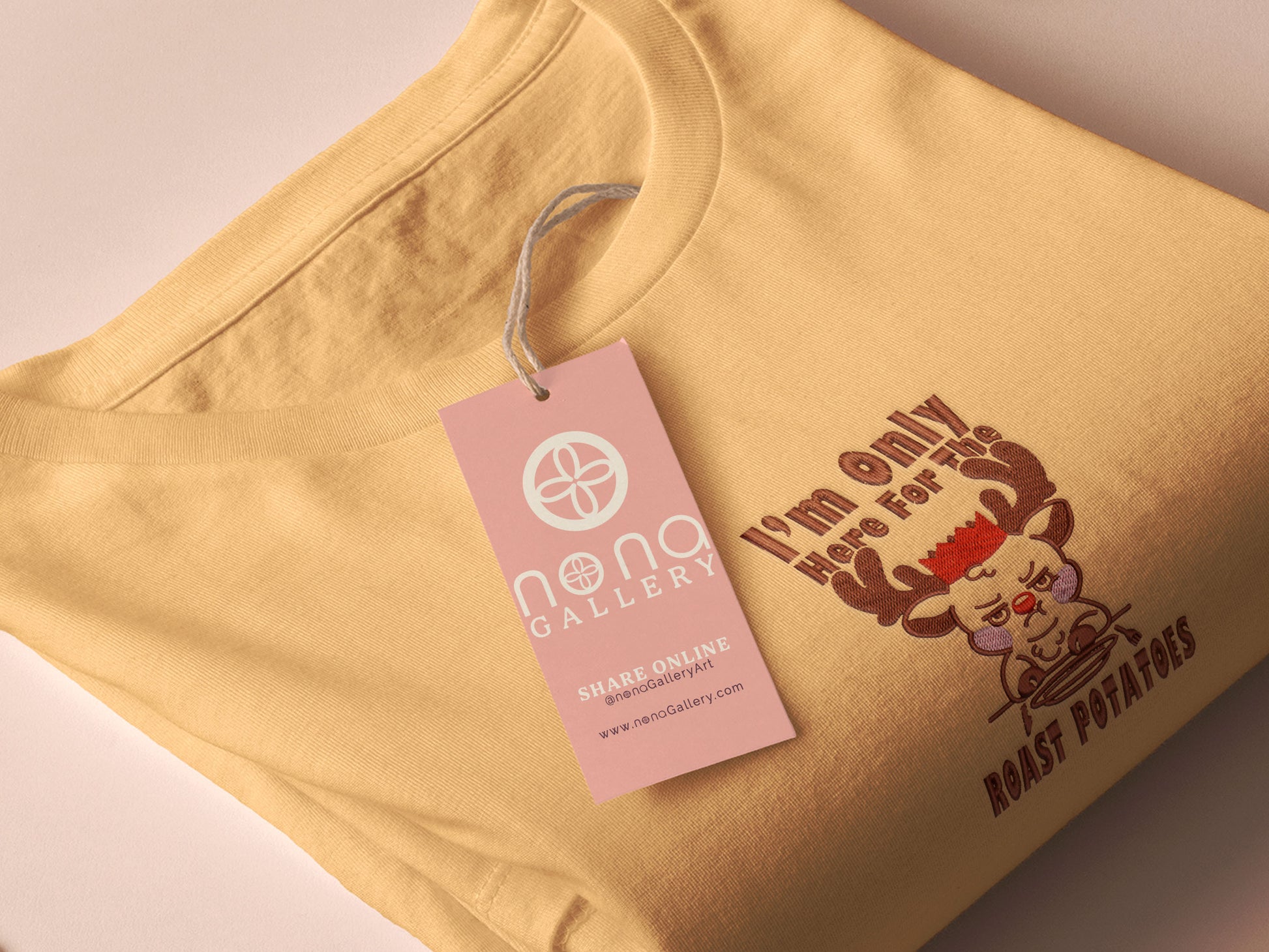 A yellow crew neck long sleeve sweater, with an embroidered design of a cute sulking Rudolph reindeer and the quote I'm only here for the roast potatoes