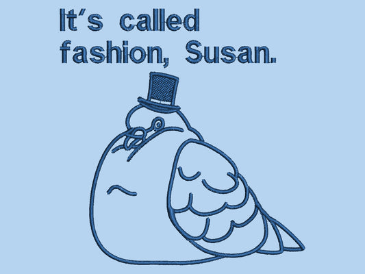 An embroidered blue tshirt design of a fat pigeon wearing a top hat and the text It's Called Fashion Susan