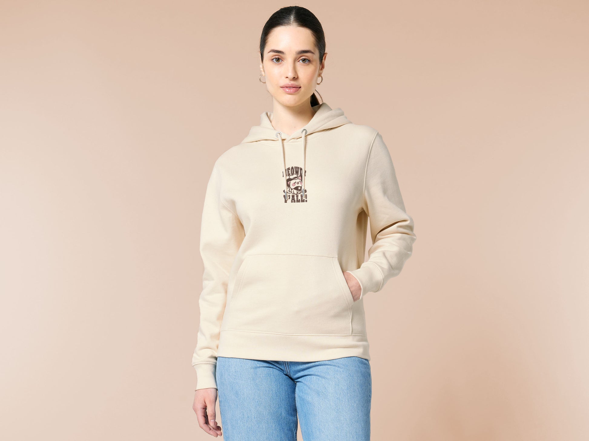 A cream crew neck long sleeve hoodie, with an embroidered brown thread design of a cute cowboy cat with hat surrounded by the quote meowfy ya'll!