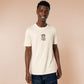 A cream crew neck short sleeve t-shirt, with an embroidered brown thread design of a cute cowboy cat with hat surrounded by the quote meowfy ya'll!