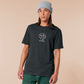 An embroidered dark grey t-shirt with a cute chibi bunny and the text Woke Up And Chose Violence.