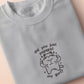 An Embroidered light grey t-shirt design of a cute chib buff cat with the text did you just pspspst my gurl?