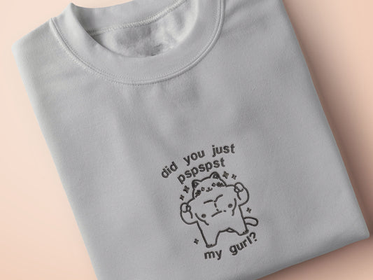 An Embroidered light grey t-shirt design of a cute chib buff cat with the text did you just pspspst my gurl?