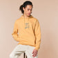 Light yellow long sleeve hoodie with embroidered pink and blue design of a cute chibi skateboarding cat with the text some people are just too cool but not me.