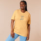 Light yellow short sleeve t-shirt with embroidered pink and blue design of a cute chibi skateboarding cat with the text some people are just too cool but not me.