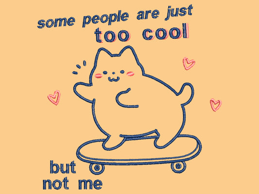 Light yellow short sleeve t-shirt with embroidered pink and blue design of a cute chibi skateboarding cat with the text some people are just too cool but not me.