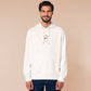 An embroidered white hoodie design of a cute cartoon goose wearing a paper hat with text underneath that reads you silly goose.