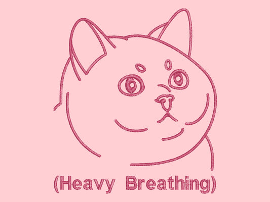 A pink crew neck short sleeve t-shirt, with an embroidered pink thread design of a cute fat cat portrait with text underneath saying (Heavy Breathing)