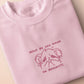 T-shirt with an embroidered Pink Design of a crying chibi hamster with the text what do you mean no dessert?!