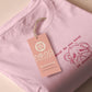T-shirt with an embroidered Pink Design of a crying chibi hamster with the text what do you mean no dessert?!