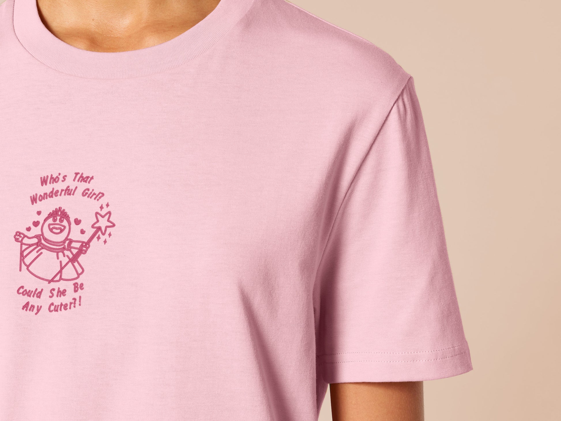 An embroidered t-shirt design of Mona from the puppet show Nanalan in a princess dress with the text Who's That Wonderful Girl, Could She Be Any Cuter?!, lyrics from the song.