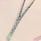 Cute full legth lanyard with a double sided fancy bird pigeon pattern and silver swivel hook clasp.