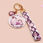 Acrylic epoxy baby penguin keychain with a large acrylic charm of two baby penguins with the quote first of all I'm a delight, a smaller charm of a cute penguin and a matching baby emperor penguin lanyard.