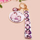 Acrylic epoxy baby penguin keychain with a large acrylic charm of two baby penguins with the quote first of all I'm a delight, a smaller charm of a cute penguin and a matching baby emperor penguin lanyard.