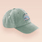 Vintage green baseball cap hat with an embroidered design of a cute blue fish with the quote Fish Want Women Me Fear Me.