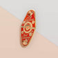 Gold Enamel Talisman Pin with red design and the words Couple's Talisman, Always & Forever. The pins design includes a hearts, ducks, as well as flowers and crystals.