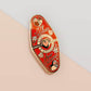 Gold Enamel Talisman Pin with red design and the words Couple's Talisman, Always & Forever. The pins design includes a hearts, ducks, as well as flowers and crystals.