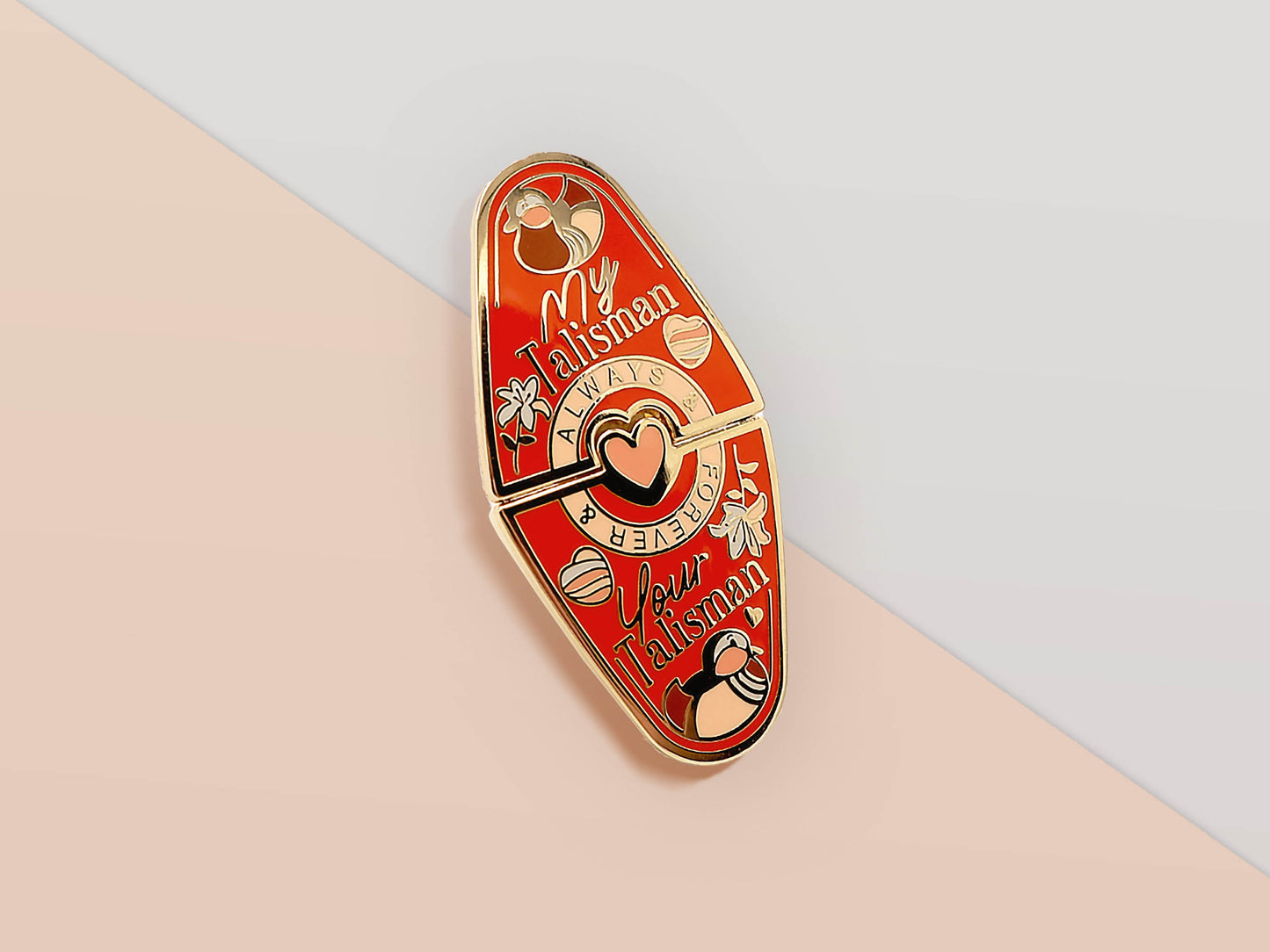Gold Enamel Talisman Pin with red design and the words Couple's Talisman, Always & Forever. The pins design includes a hearts, ducks, as well as flowers and crystals.