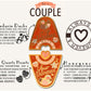 A illustrated diagram outline the symbolism of the different design elements of the for a Couple's Talisman pin. Information includes the meaning of the Mandarin ducks, rose quartz hearts and honeysuckle.