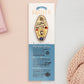 Gold Enamel Talisman Pin with yellow design and the words Father's Talisman sits on a long white and blue backing card with gold accents. The backing card has details the symbolism of the different design elements of the Talisman pin.