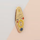 Gold Enamel Talisman Pin with yellow design and the words Father's Talisman, Strength Wisdom Love. The pins design includes a fathers and child's footprint, sunshine, hearts, as well as flowers and crystals.