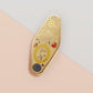 Gold Enamel Talisman Pin with yellow design and the words Father's Talisman, Strength Wisdom Love. The pins design includes a fathers and child's footprint, sunshine, hearts, as well as flowers and crystals.