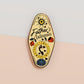 Gold Enamel Talisman Pin with yellow design and the words Father's Talisman, Strength Wisdom Love. The pins design includes a fathers and child's footprint, sunshine, hearts, as well as flowers and crystals.