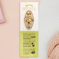 Gold Enamel Talisman Pin with yellow design and the words Mother's Talisman sits on a long white and green backing card with gold accents. The backing card has details the symbolism of the different design elements of the Talisman pin.