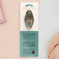Gold Enamel Talisman Pin with blue design and the words Musician's Talisman sits on a long white and blue backing card with gold accents. The backing card has details the symbolism of the different design elements of the Talisman pin.