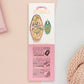 Gold Enamel Talisman Pin with mini charm and the words Pet Owner's Talisman sits on a long white and pink backing card with gold accents. The backing card has details the symbolism of the different design elements of the Talisman pin.