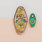 Gold Enamel Talisman Pin with mini charm and the words Pet Owner's Talisman, unconditional love. The pins design includes a pets collar and a Japanese lucky charm, as well as hearts, flowers and crystals.