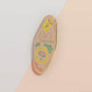 Gold Enamel Talisman Pin and the words Pet Owner's Talisman, unconditional love. The pins design includes a pets collar and a Japanese lucky charm, as well as hearts, flowers and crystals.